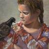 Girl feeding a pigeon on her arm