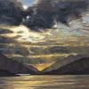 The sun setting over the loch of Glencoe surrounded by mountains